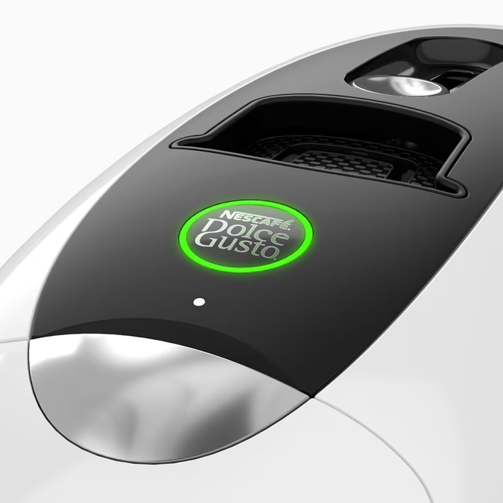 Machine à café NEO Latte blanche avec bouton de démarrage allumée en vert.