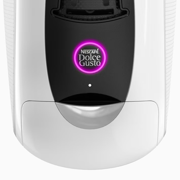 Machine à café NEO Latte blanche avec bouton de démarrage allumé en violet.